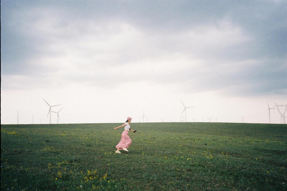 energy communities, fields, girl who is running